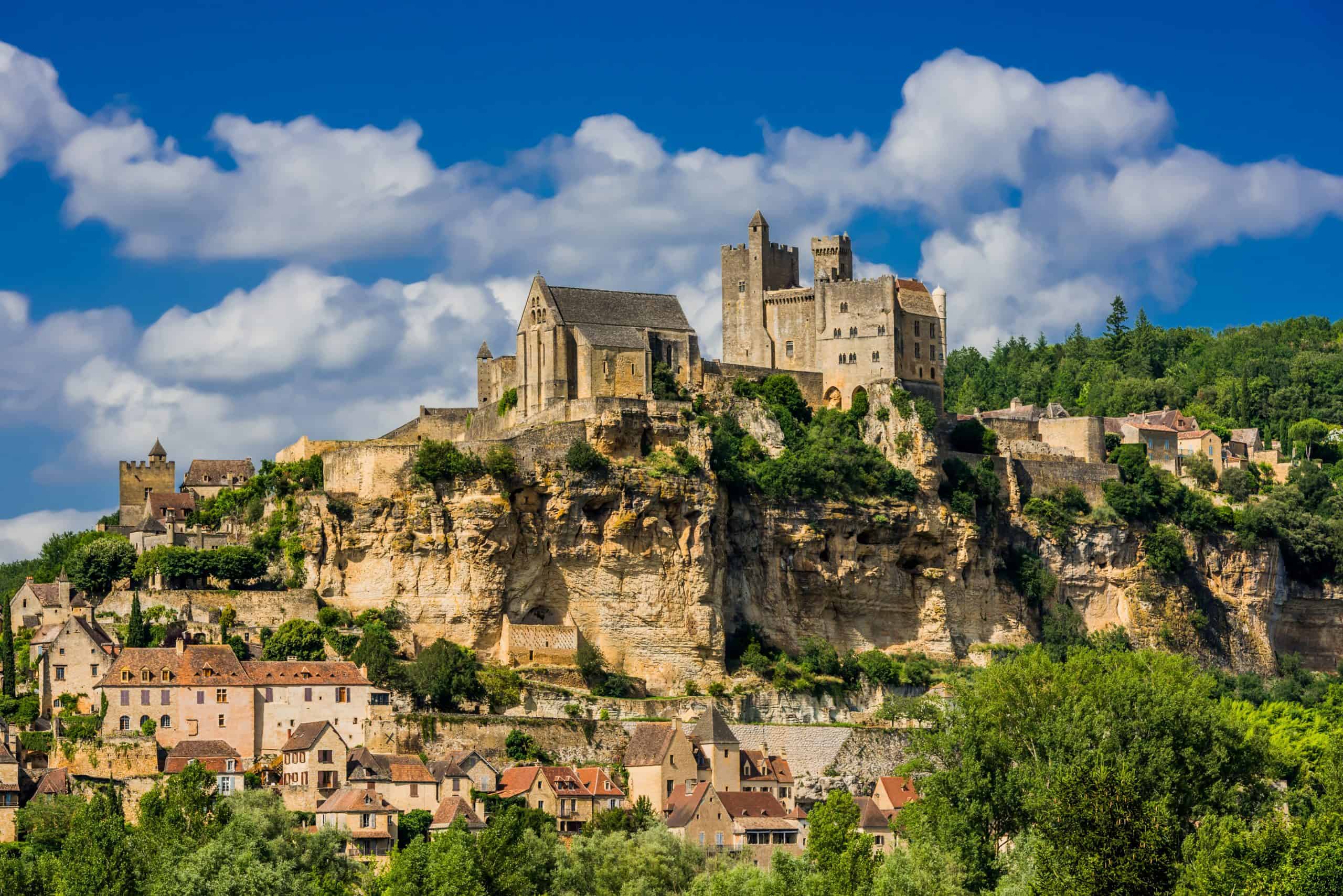 Ancient castle overlooking the Périgord region, showcasing medieval architecture and scenic views.