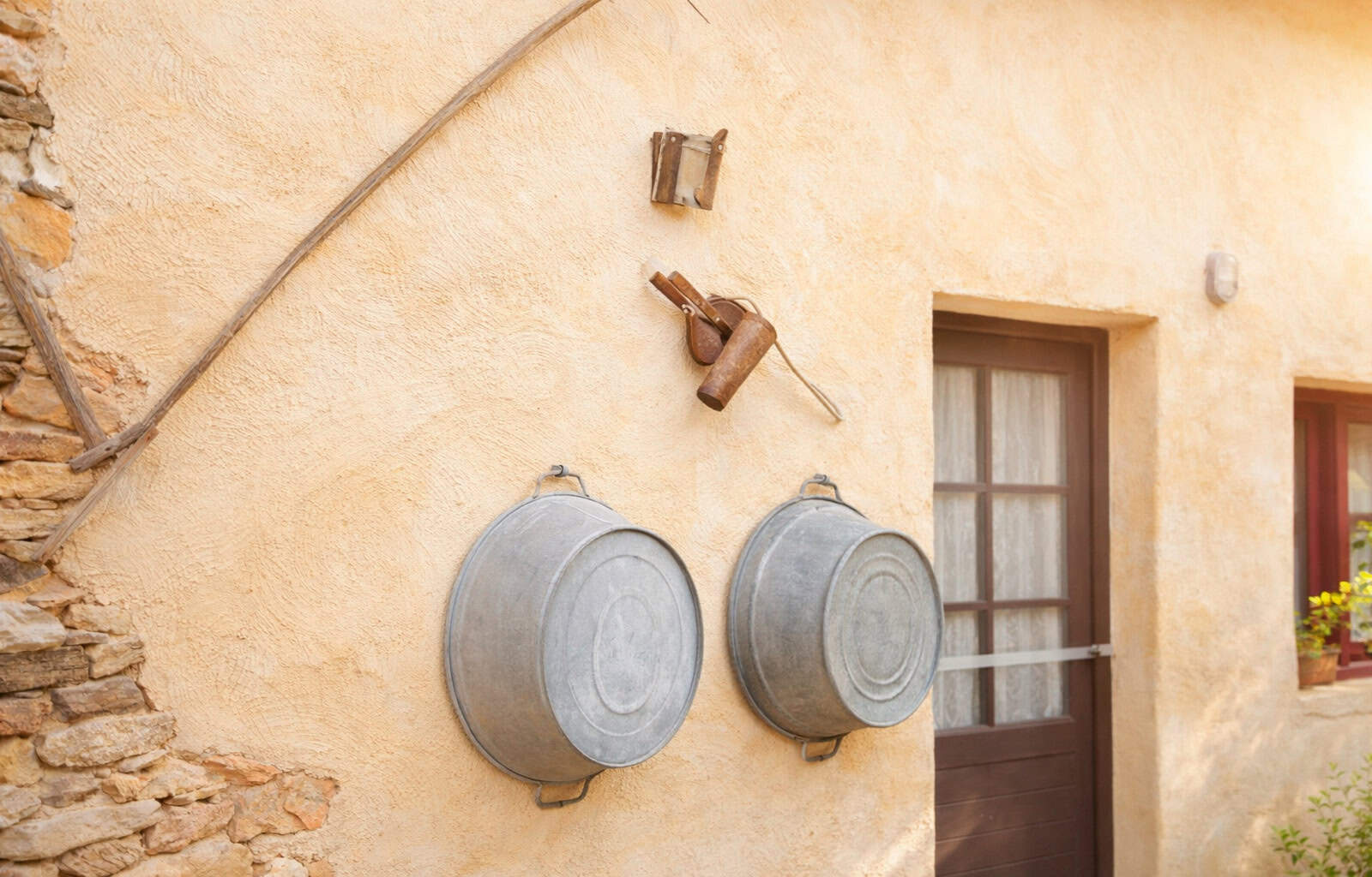 Traditional rural water containers on wall.